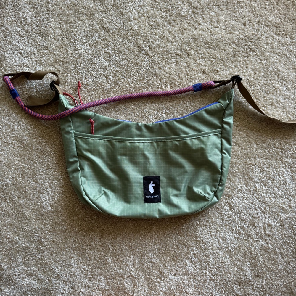 Cotopaxi Sage Green Crossbody Bag with Magenta Strap